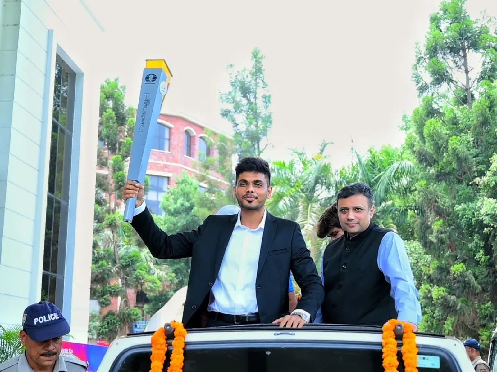 GM Akash Ganesan carrying the Olympiad torch