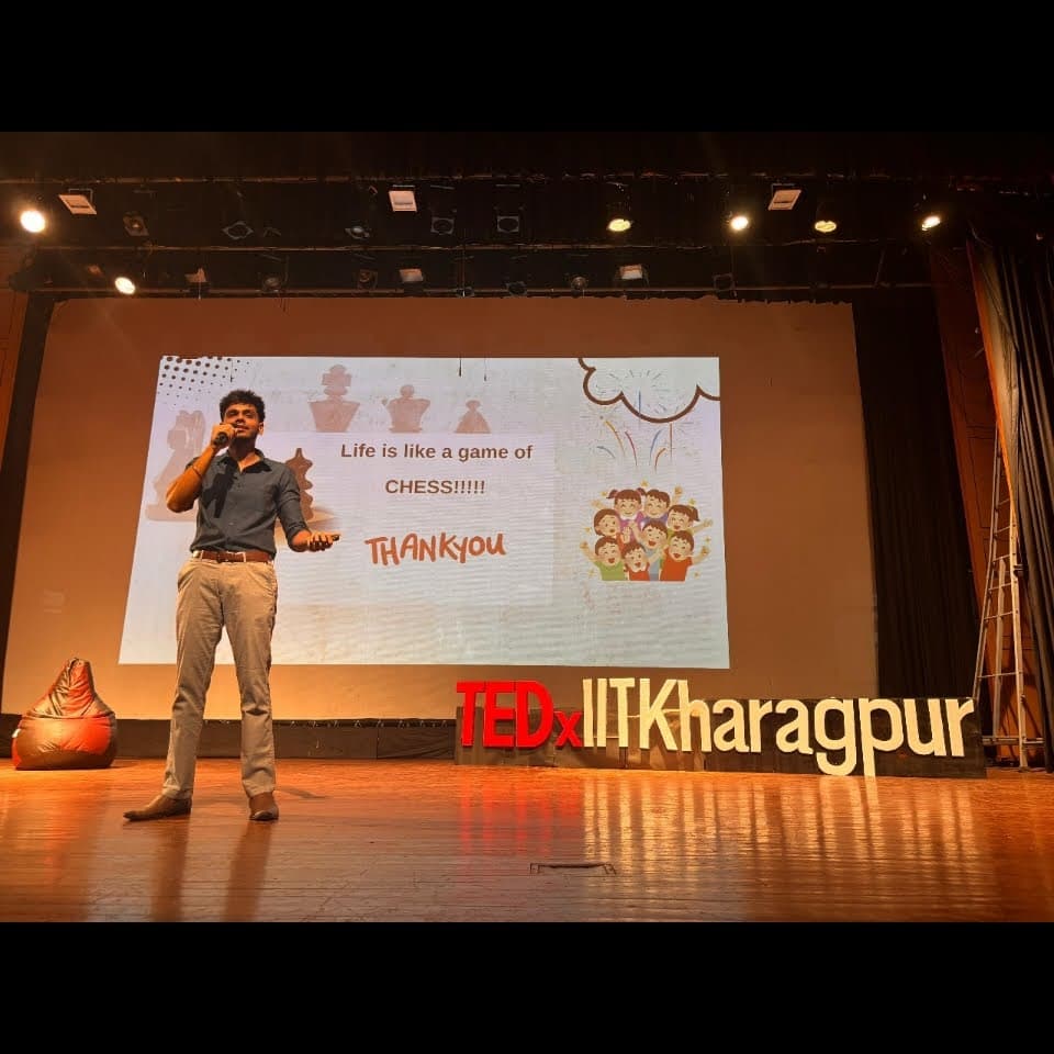 GM Akash Ganesan speaking on the TEDx stage